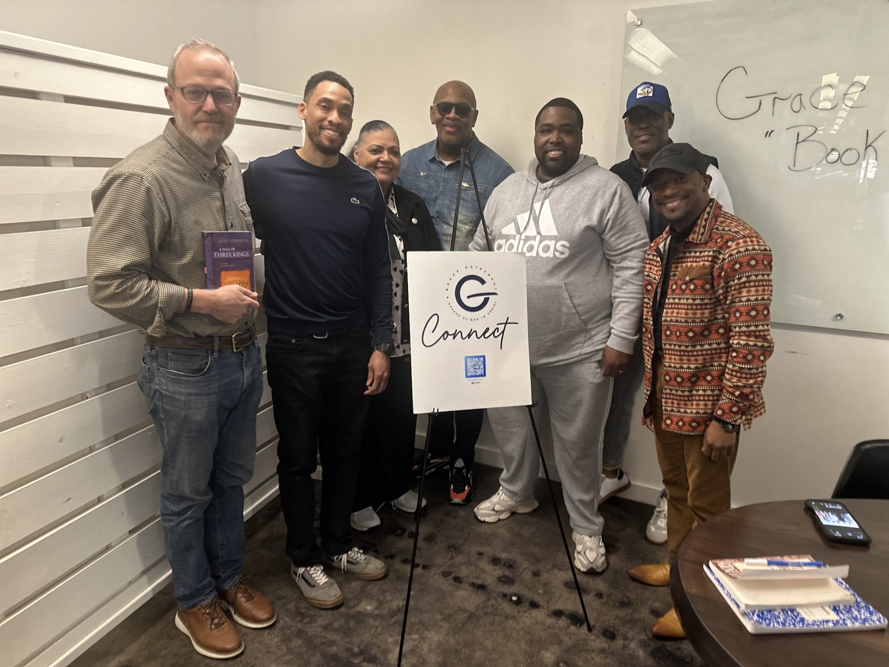 Grace Connect Book Club participants together with their Connect sign